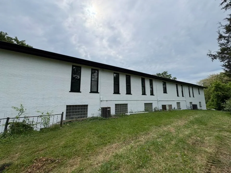 White-painted commercial building exterior — new construction project